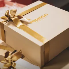 This personalized gift box, created for a special event, showcases how I can incorporate your unique branding or wedding monogram with elegant gold satin ribbons for a truly exclusive feel.