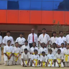 Students of the main HPKA branch after their belt grading exam. You can see the different belt colors, showing the levels of progression.
