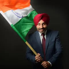 A proud and patriotic portrait for a professional profile. Incorporating the Indian flag adds a layer of personal identity and pride, making this corporate headshot stand out.