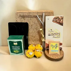 This Diwali, I encourage you to "Grow Memories, Not Waste" with my sustainable gift hamper. It includes eco-friendly items like plantable seeds, green tea, and almond brittle in a natural fiber box.