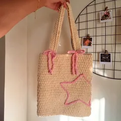 I’m obsessed with how this Pinterest-inspired tote bag turned out. The soft cream color, cute lavender bows, and star detail make it a dreamy accessory for carrying your essentials. It's all handmade with a cozy, plush texture.