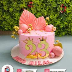 A chic pink cake for Bilal's 23rd birthday. The gold numbers, crowns, and modern fan decorations make it a stylish and royal choice for a milestone celebration.