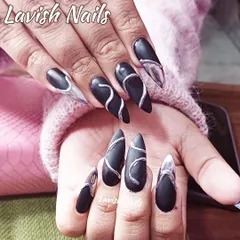 A dramatic matte black stiletto set with bold silver chrome swirls and accents.