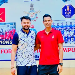 Divided by our service teams, but united by our love for volleyball and our nation. Posing here against a backdrop of Air Force and Navy emblems.