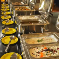 A lavish buffet spread with a wide variety of dishes, ensuring there's something delicious for everyone to enjoy.