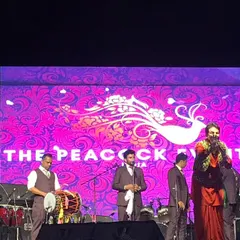 Capturing the moment. Gurdas Maan engaging with the crowd during the successful concert we organized. Our event management services include full artist liaison and on-stage support.