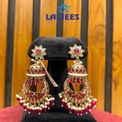These maroon jhumkas with pearl drops are a classic choice for any wedding guest or for a bride's smaller functions.