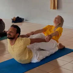 Partner work is an integral part of our Advanced TTC. Here, students assist each other to deepen the backbend in Dhanurasana (Bow Pose), fostering trust and mutual support.