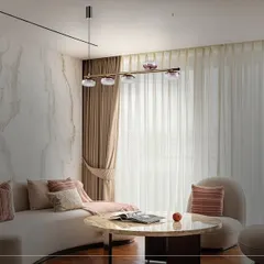 Here is the same living space, but with a different lighting choice: a minimalist linear fixture with smoked glass globes. This demonstrates how changing the central light can completely alter the room's mood to something more subtle and understated.