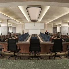 An identical render of the grand conference hall, showcasing the luxurious material palette of wood, stone, and plush carpeting that creates an atmosphere of authority and prestige.