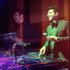 A creative long-exposure shot capturing the energy and movement behind the decks at the Prestige event.