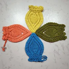 Four pineapple pouches arranged in a pinwheel. I love making these in various colors like orange, yellow, blue, and olive green.