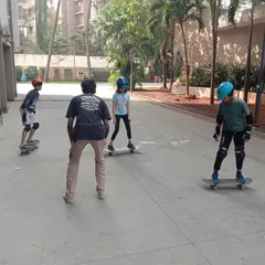 Skateboarding is an amazing skill that builds balance and courage. Here, our coach provides instruction to a small group, ensuring each student gets personalized tips to improve their technique safely.