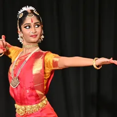 The poise and focused gaze of a dancer during her arangetram tells a story of dedication. This moment from Anvita Jain's debut highlights the strong lines and expressive posture that we cultivate through years of practice.