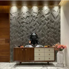 For this entryway in Jodhpur, I installed a highly detailed textured wall panel. This serves as a dramatic backdrop for the decor and also helps to diffuse sound in the marble-floored space.