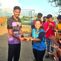 Recognizing the fighting spirit. A female player receives the 'Fighter of the Match' award, a testament to her grit and determination on the field.