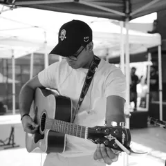 Tuning my guitar during soundcheck. Every detail matters when you're preparing for a big show. We are meticulous in our setup to ensure a flawless performance.