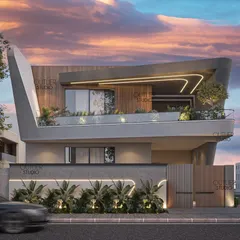 A closer look at the home with the curved facade, this angle shows how the cantilevered balcony creates a sheltered outdoor space. The integrated lighting within the structure emphasizes its unique form, especially at dusk.
