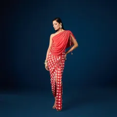 A full view of the Seona Draped Dress by Aapro, captured with a spotlight effect on our painted cyclorama for a theatrical and high-fashion look.