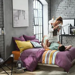 Capturing a quiet, intimate moment at home. This image helps customers connect with the product on an emotional level, imagining themselves enjoying lazy weekend mornings with their partner.