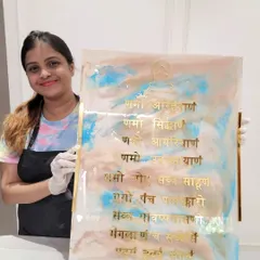 Here I am with a completed Navkar Mantra frame, ready for the student to take home. The combination of soft colors, crystals, and the sacred text is truly special.
