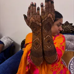 The full view of the Pakistani bridal design, showing how the patterns create a cohesive and stunning look from fingertips to elbow.