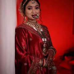 This stunning bride in her red lehenga is a perfect example of a classic North Indian bridal look. We focused on radiant skin, bold eyes, and a traditional bridal bun adorned with flowers.