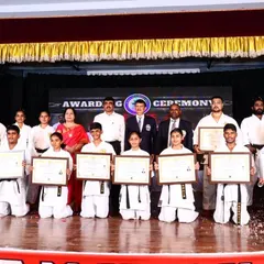 Our black belt achievers kneeling with their certificates after the awarding ceremony. This moment of 'seiza' reflects the discipline and humility instilled throughout their training.