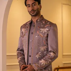 This angle showcases the craftsmanship on the sleeve and front panel of the mauve Jodhpuri. It's a perfect blend of traditional motifs and a modern color palette.