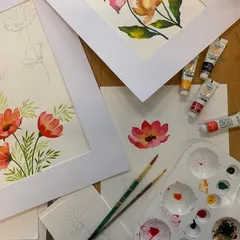 A beautiful flat lay of watercolor florals created in our workshop. We teach easy, step-by-step techniques to help you master this delicate medium.