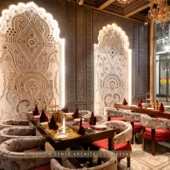 The magic is in the details. This dining section features custom-designed, backlit panels with intricate carvings, creating an intimate and opulent atmosphere for guests. It's about making every corner of the restaurant feel special.