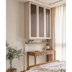 In this bedroom, I built the wooden study desk and the floating wall cabinet with fluted glass doors. The design combines classic turned legs on the desk with modern, clean lines for the storage, showing how I can mix styles within a single room.