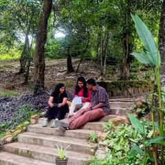 We take our work wherever inspiration strikes. Here, a small group is deep in a story development session on the steps outside, surrounded by the natural beauty of the resort. A change of scenery can often unlock new perspectives on a difficult plot point.