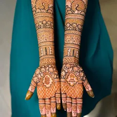 A classic full bridal mehendi design that is both grand and elegant. The symmetrical patterns feature my signature peacocks, delicate lotuses, and intricate jaal work for a timeless look.