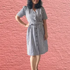This gingham dress is a great example of a versatile piece. With an attached belt, you can tie it in different ways to create multiple silhouettes, changing the look from classic to modern.