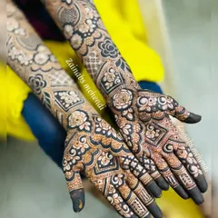 Another view of this Pakistani and Arabic fusion design, showing how the patterns complement each other across both hands for a complete bridal look.
