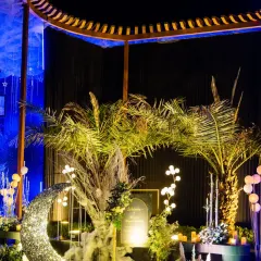 A wider view of the celestial-themed birthday decor, featuring a sparkling crescent moon prop perfect for photos.