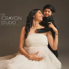 A soon-to-be big brother shares a sweet moment with his mother. This portrait beautifully captures the existing bond while celebrating the new life that is about to join their family.