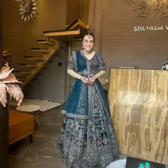 My clients always find the perfect fit. This full-length shot shows the grandeur of the embroidered bridal lehenga, a popular choice for brides.