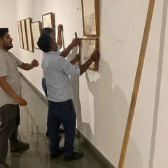 The team and artist Mohit Mahato hanging works for his show 'Bring me Flowers'. I work closely with artists to ensure the final hang aligns with their vision for the exhibition.