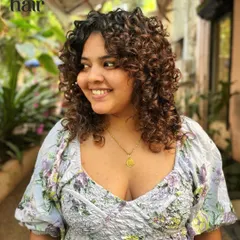 Another look at this gorgeous curly bob, showing how the layers frame the face and create a beautiful silhouette from every angle.