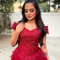 A glamorous look for a cocktail party or reception. This client is wearing a beautiful red gown, and her makeup features a dramatic smokey eye and a perfectly blended base.