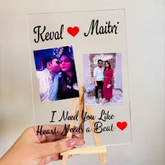 This A5 size acrylic snap frame holds two photos and is personalized with the couple's names and a sweet quote. It comes with a mini wooden easel for display.
