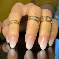 A close-up of a perfect baby boomer ombre, showing the soft gradient on well-manicured nails.