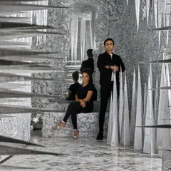 A portrait of us within the 'Palate Cleanser' installation. The mirrored walls create an infinite, crystalline world, showing how a simple passage can be transformed into a memorable art piece.