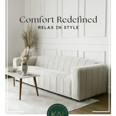 This elegant white sofa features vertical channel tufting, offering a modern yet timeless look. We designed it to provide both exceptional comfort and a sophisticated silhouette, making it a perfect anchor piece for a light and airy living room.
