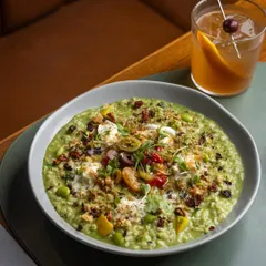 The perfect pairing. Our creamy Spring Vegetable and Hazelnut Pesto Risotto finds its match in a classic, spirit-forward cocktail. It is a harmony of comfort and sophistication.