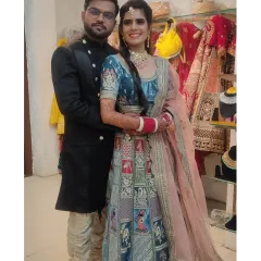 Here’s how I help couples create a perfectly coordinated look. This bride’s unique Doli Barat lehenga pairs beautifully with the groom's classic black bandhgala sherwani.