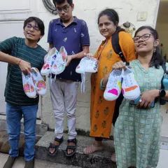 Another shot of proud artists with their finished work. In my workshops, everyone starts with a blank canvas, in this case shoes, and leaves with something that is 100% them.