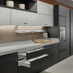 A detailed look at a drawer-within-a-drawer system. This solution maximizes storage capacity and makes it easy to organize cutlery, utensils, and other small items, keeping your countertops clear.